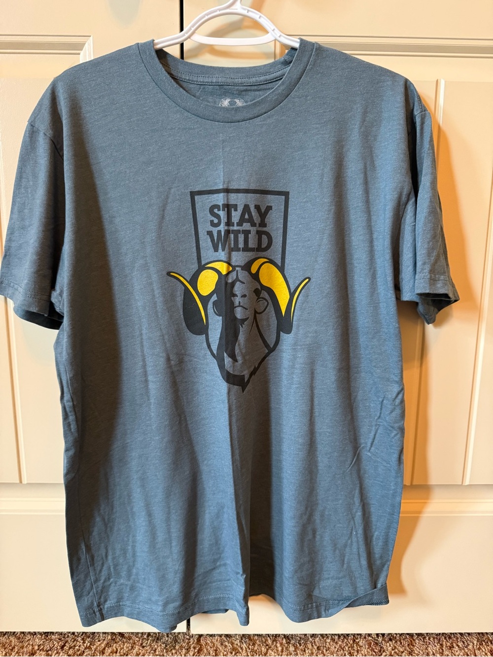 KUIU Blue Graphic 'Stay Wild' Tee with Yellow Accents